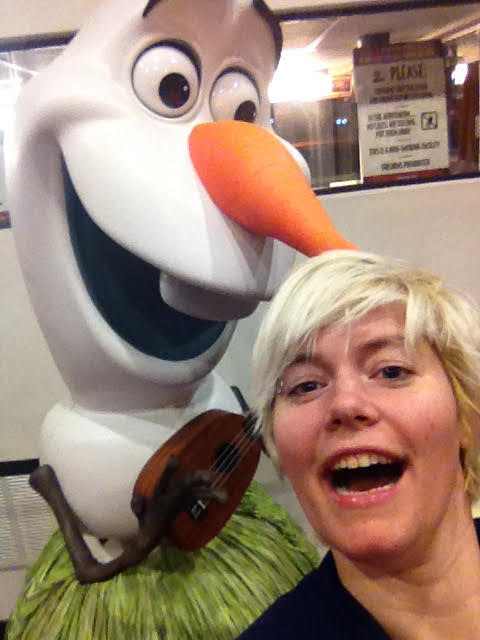 Pamela Fox smiling beside an Olaf statue