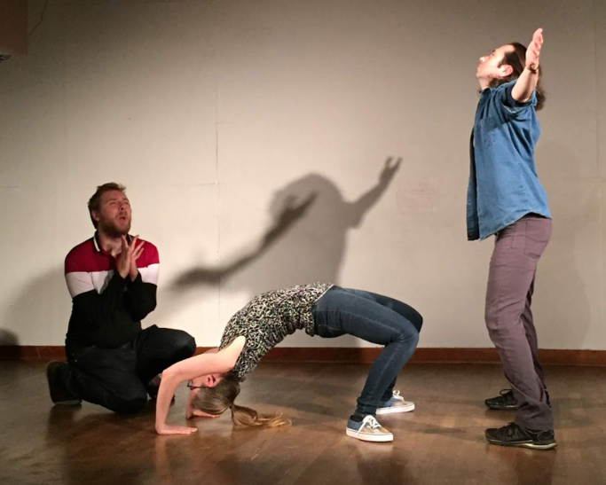 Three people in an improv scene